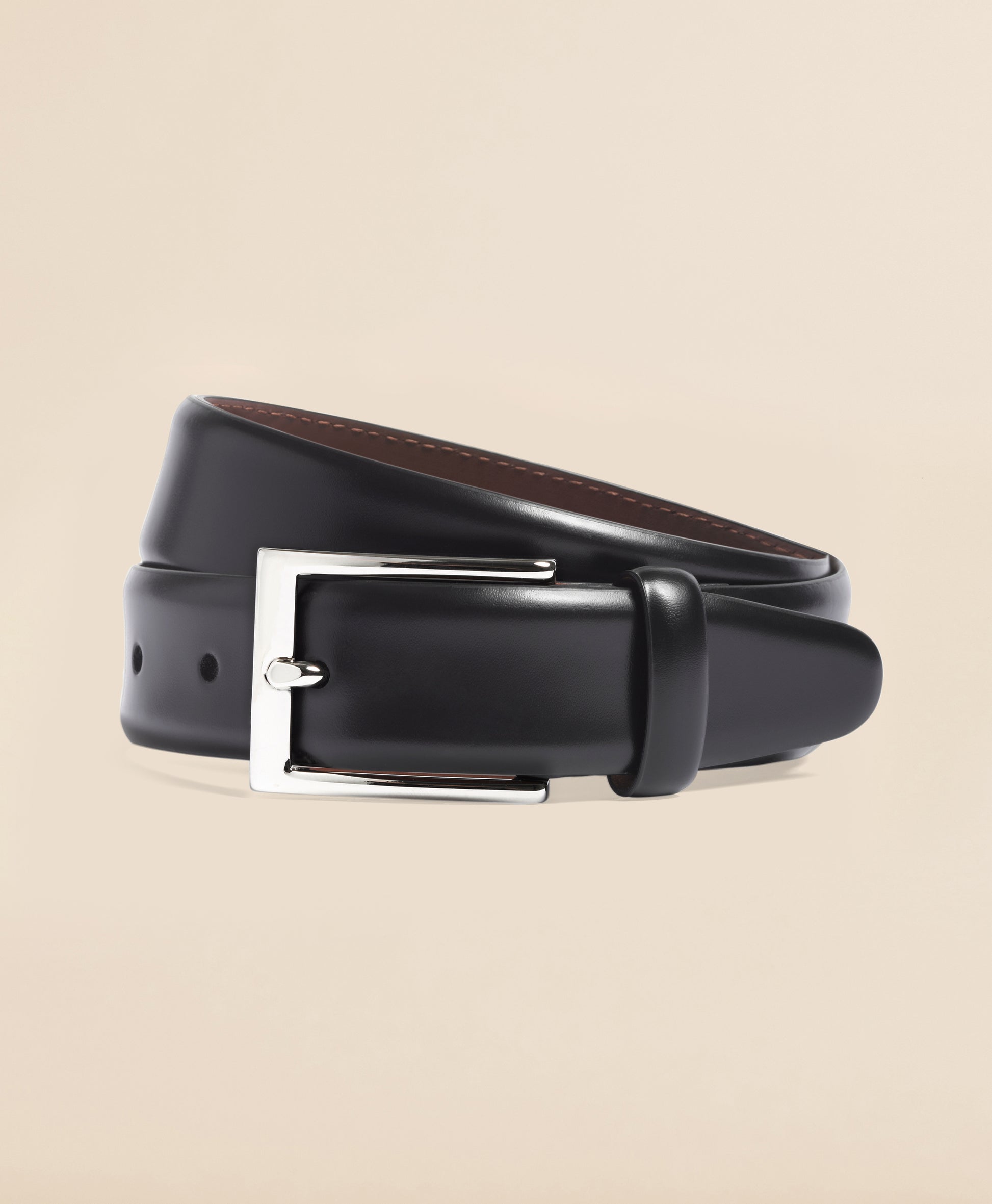 Black leather belt with a silver buckle