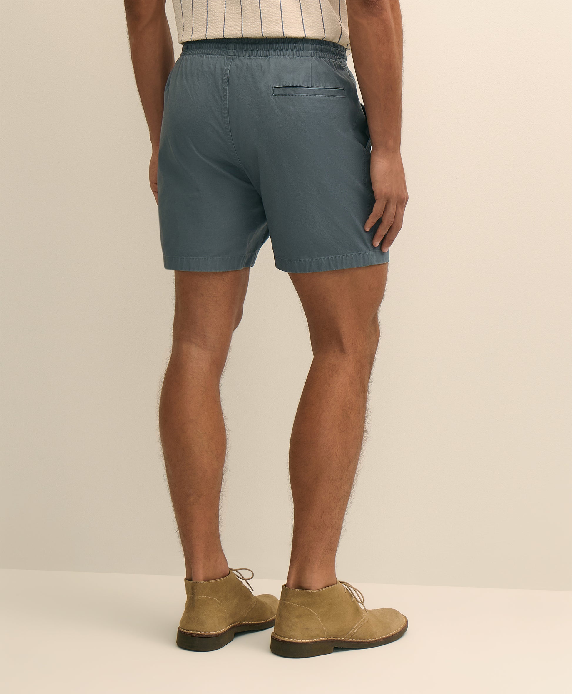 Person wearing teal shorts