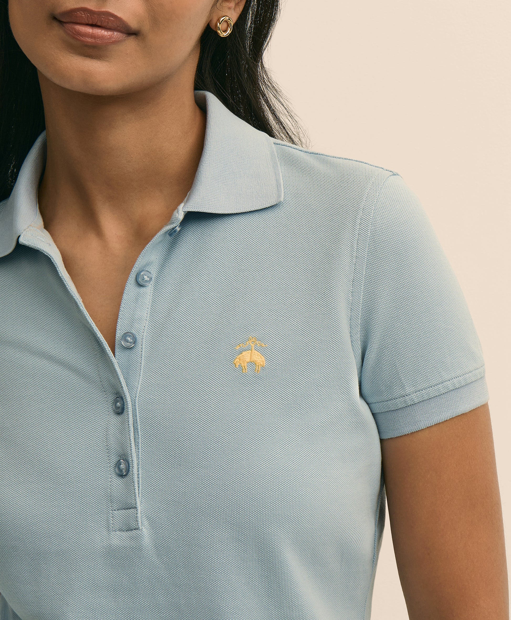Light blue polo shirt with a logo