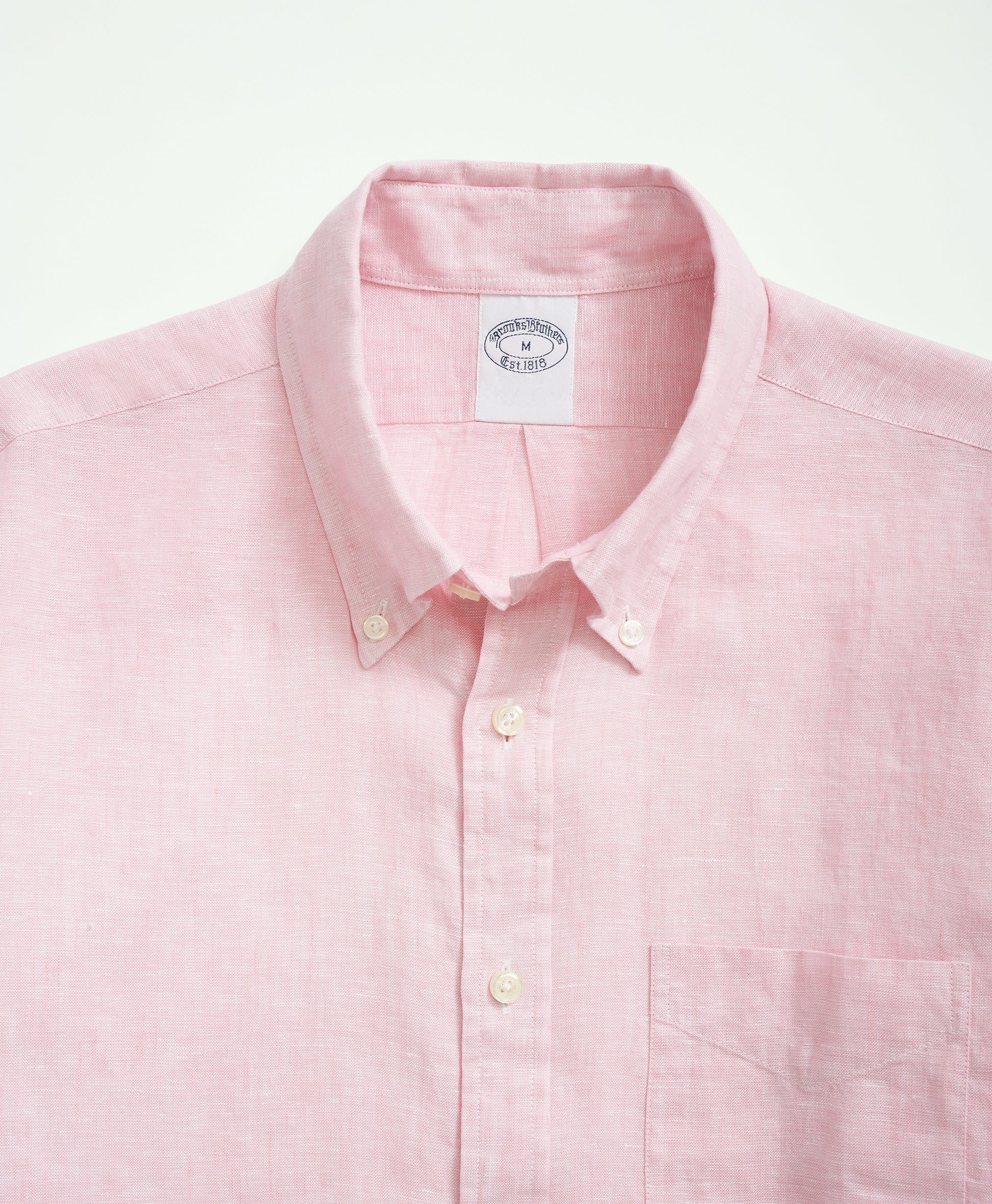 Brooks Brothers men's short-sleeve pink shirt with navy fish print.