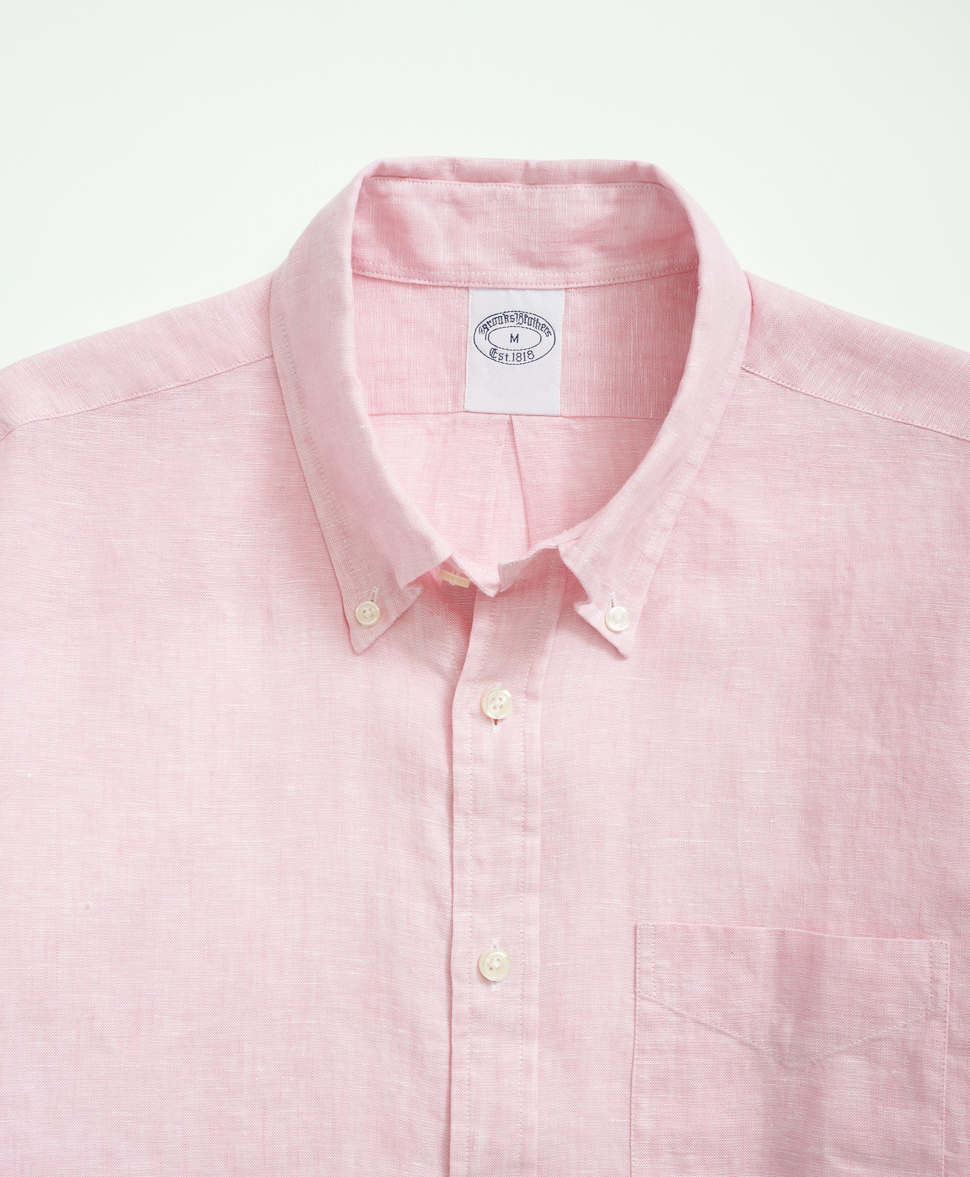 Brooks Brothers men's short-sleeve pink shirt with navy fish print.