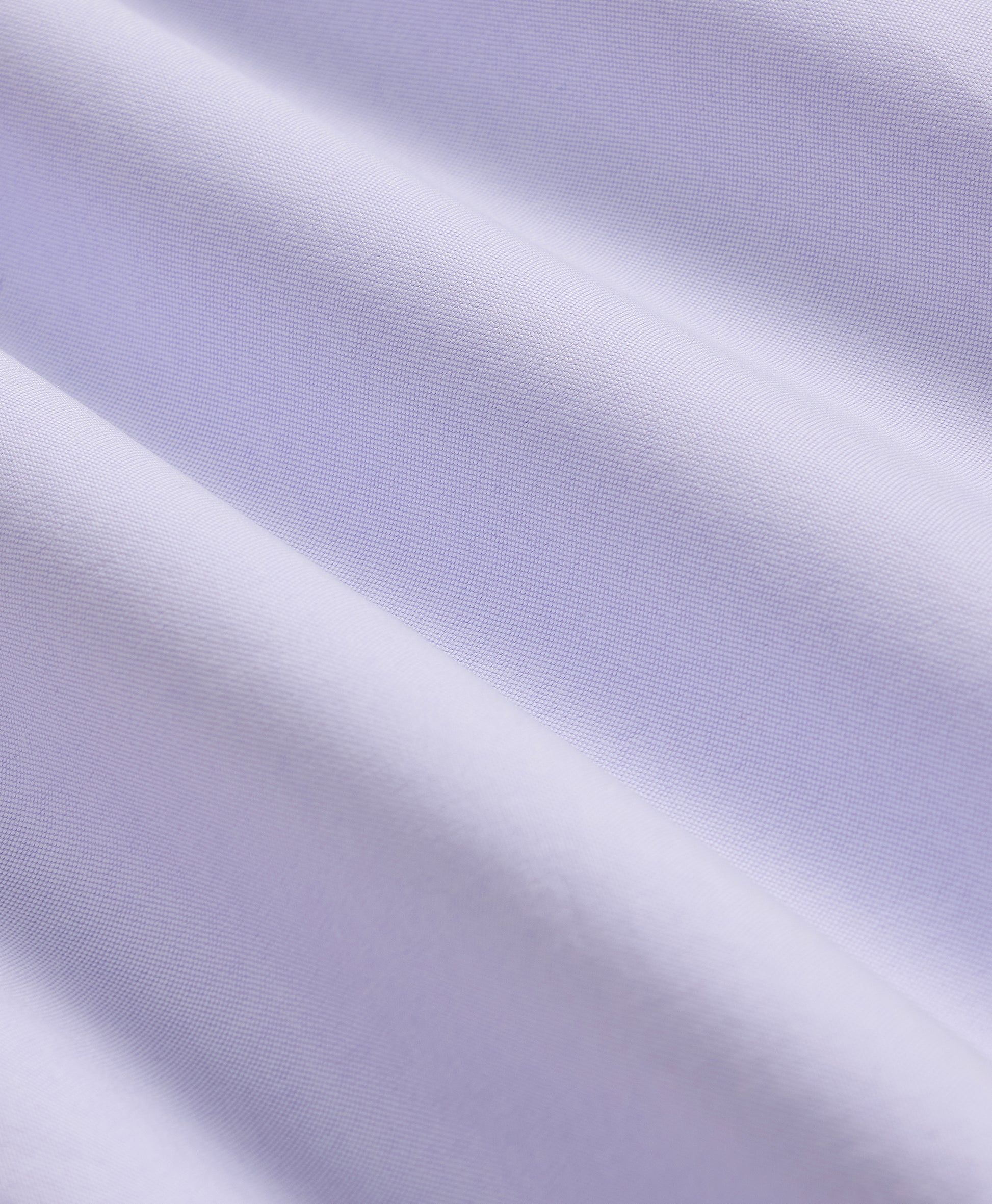 Close-up of light purple fabric with a subtle pattern