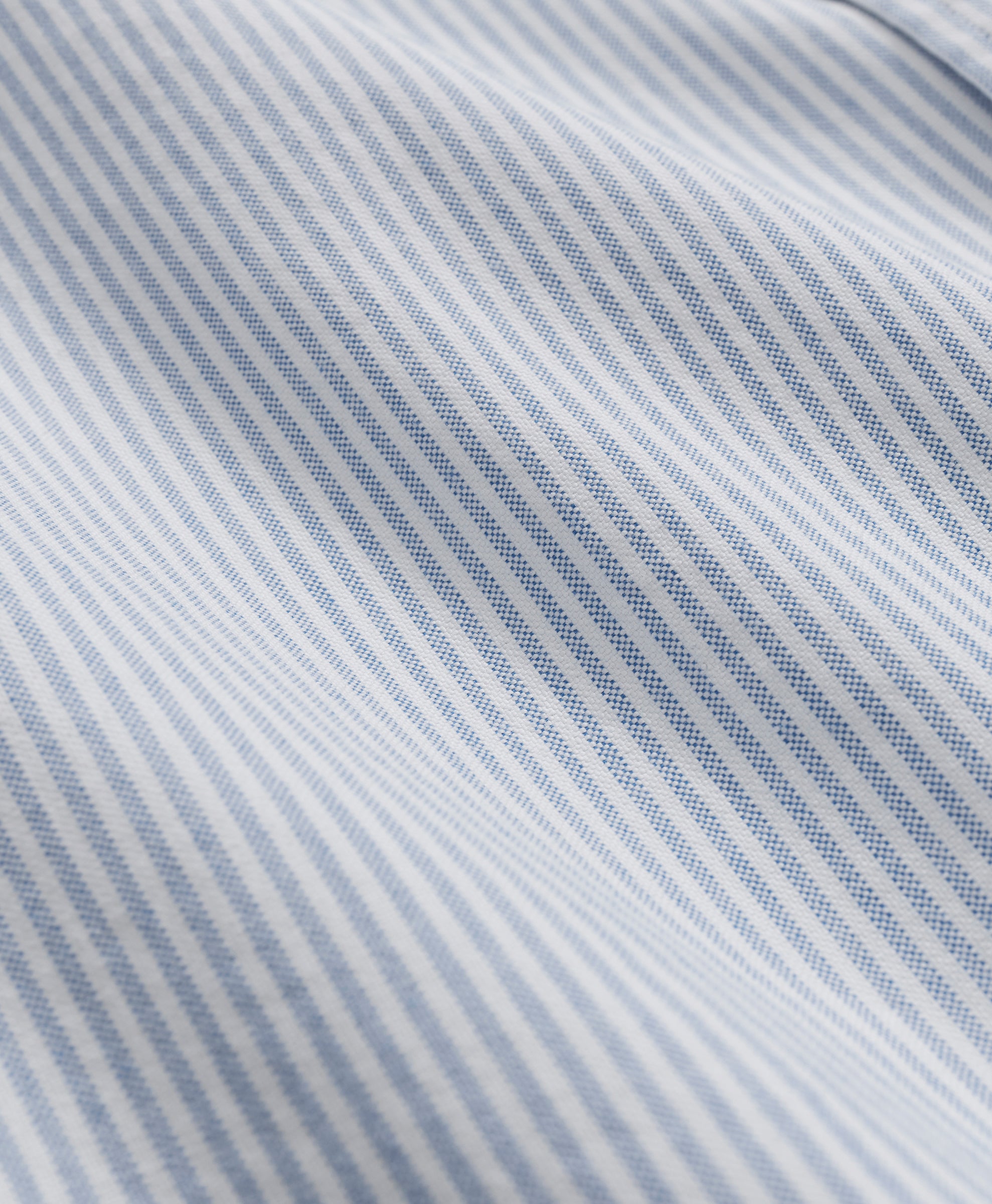 Close-up of fabric with blue and gray diagonal stripes