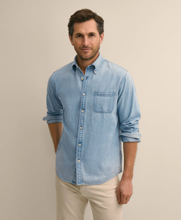 Man wearing a light blue denim shirt
