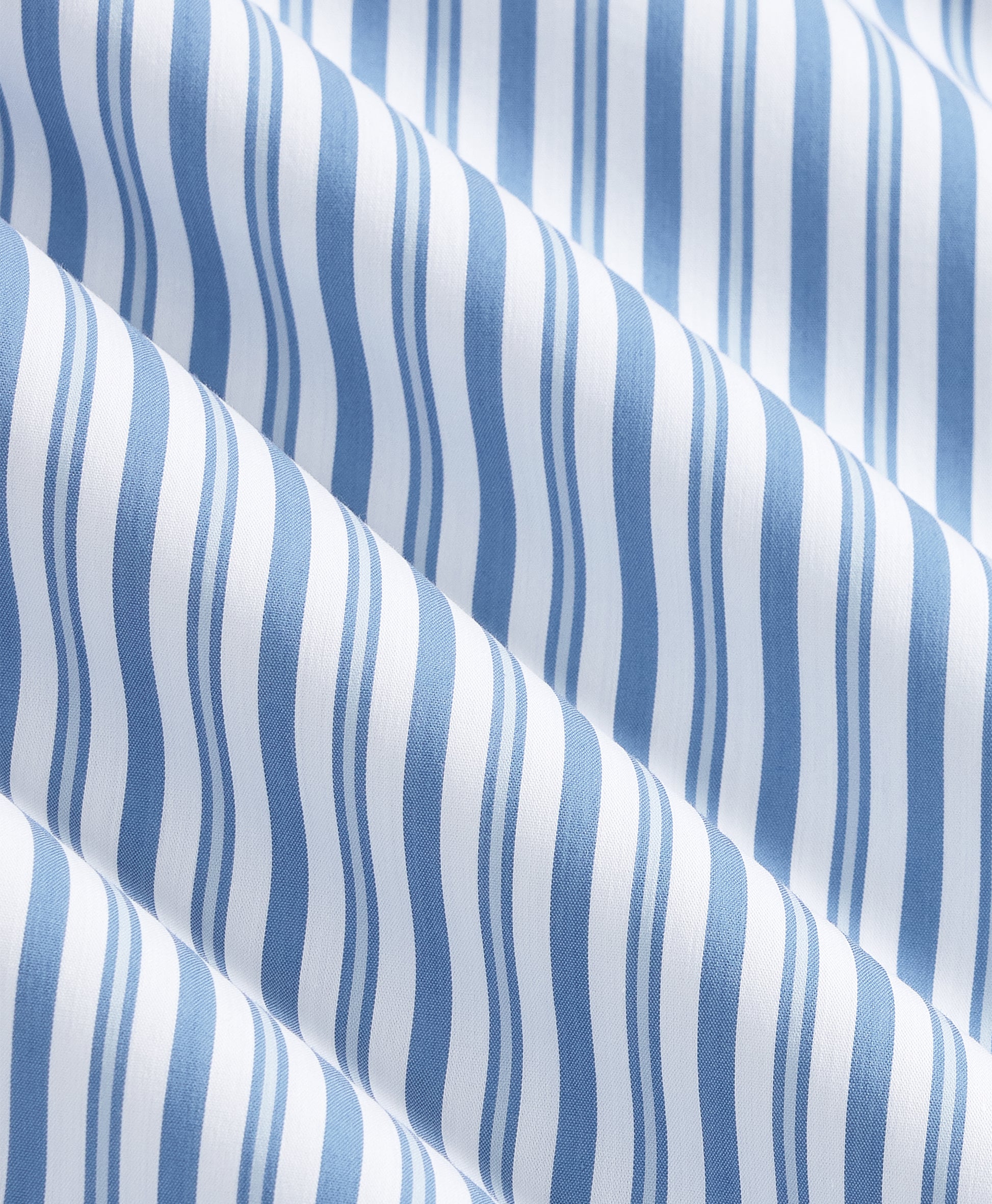 Close-up texture of navy cotton fabric with anchor and rope print.