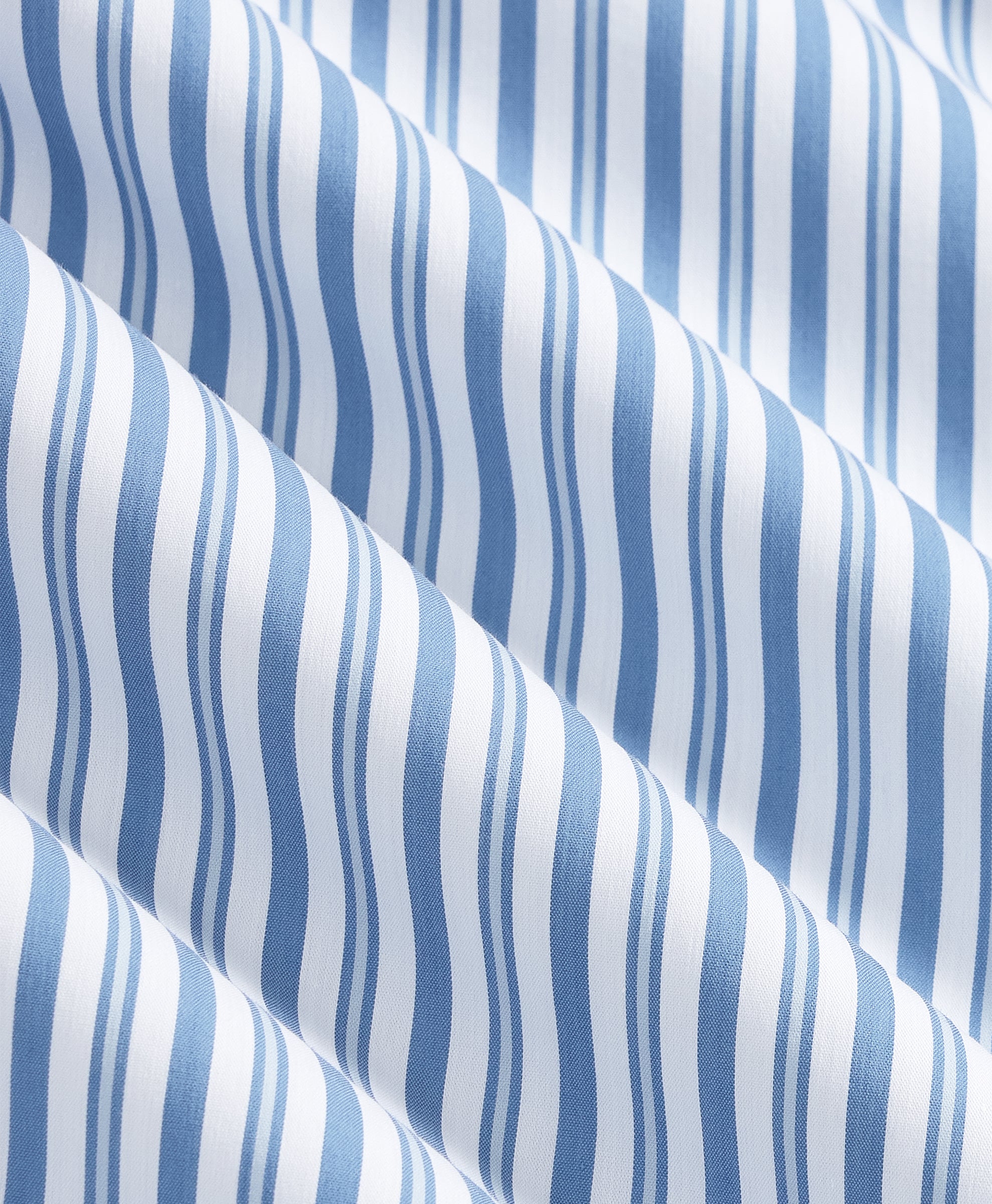 Close-up texture of navy cotton fabric with anchor and rope print.
