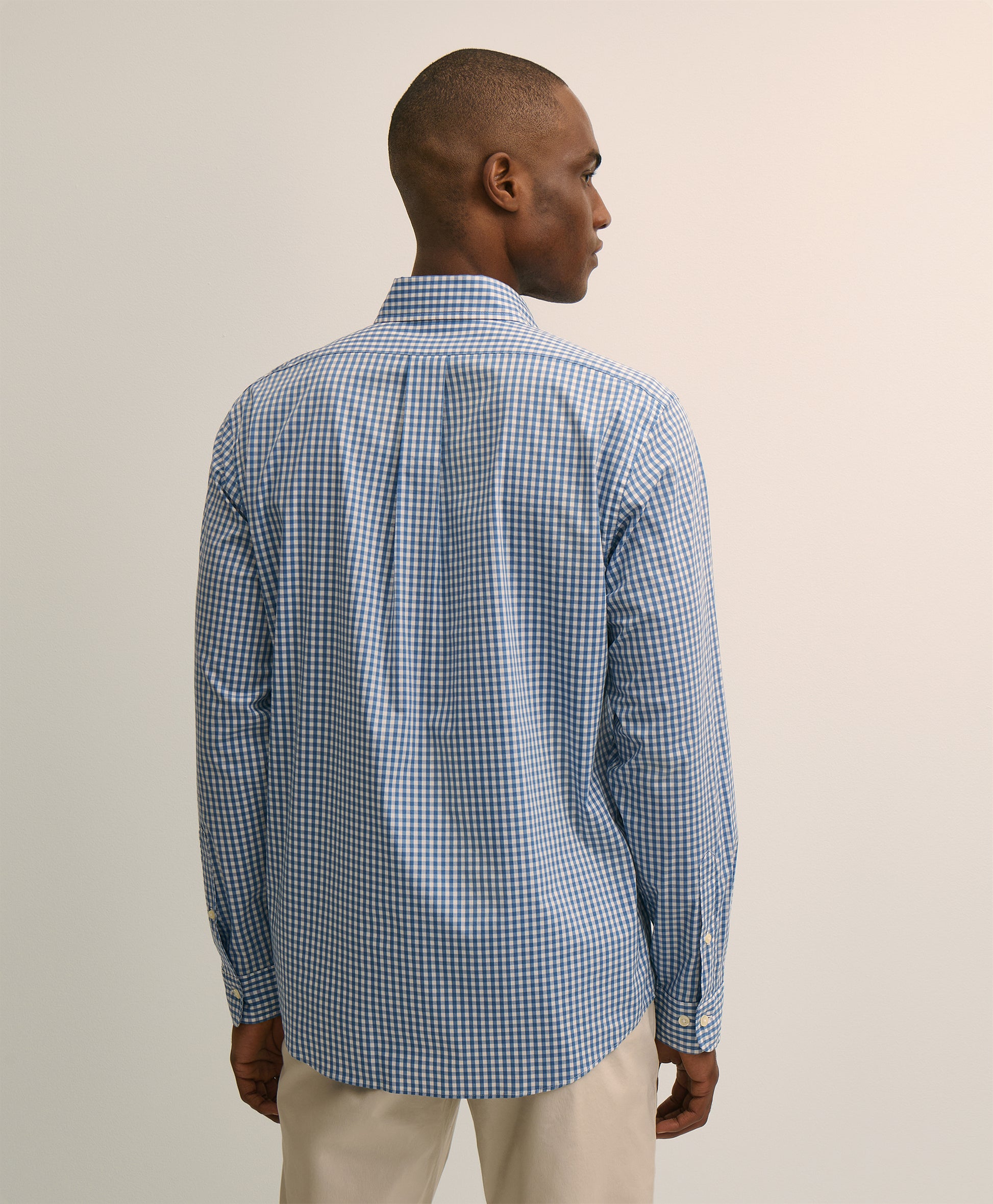 Man wearing a blue checkered shirt