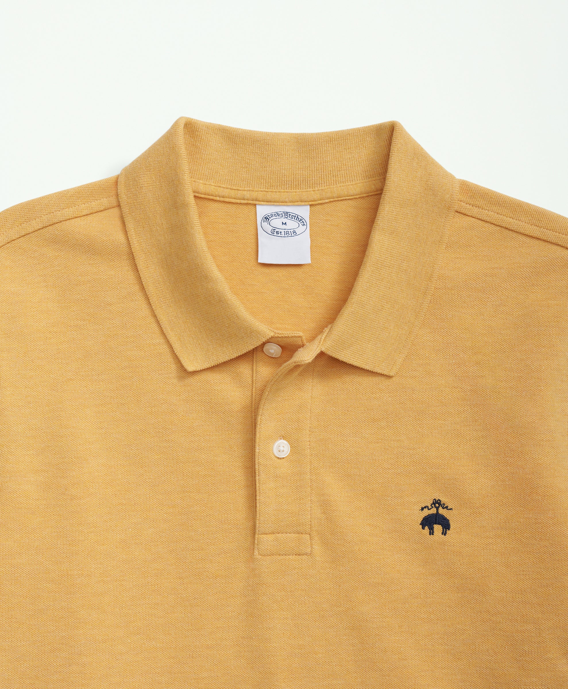 Yellow polo shirt with a small logo