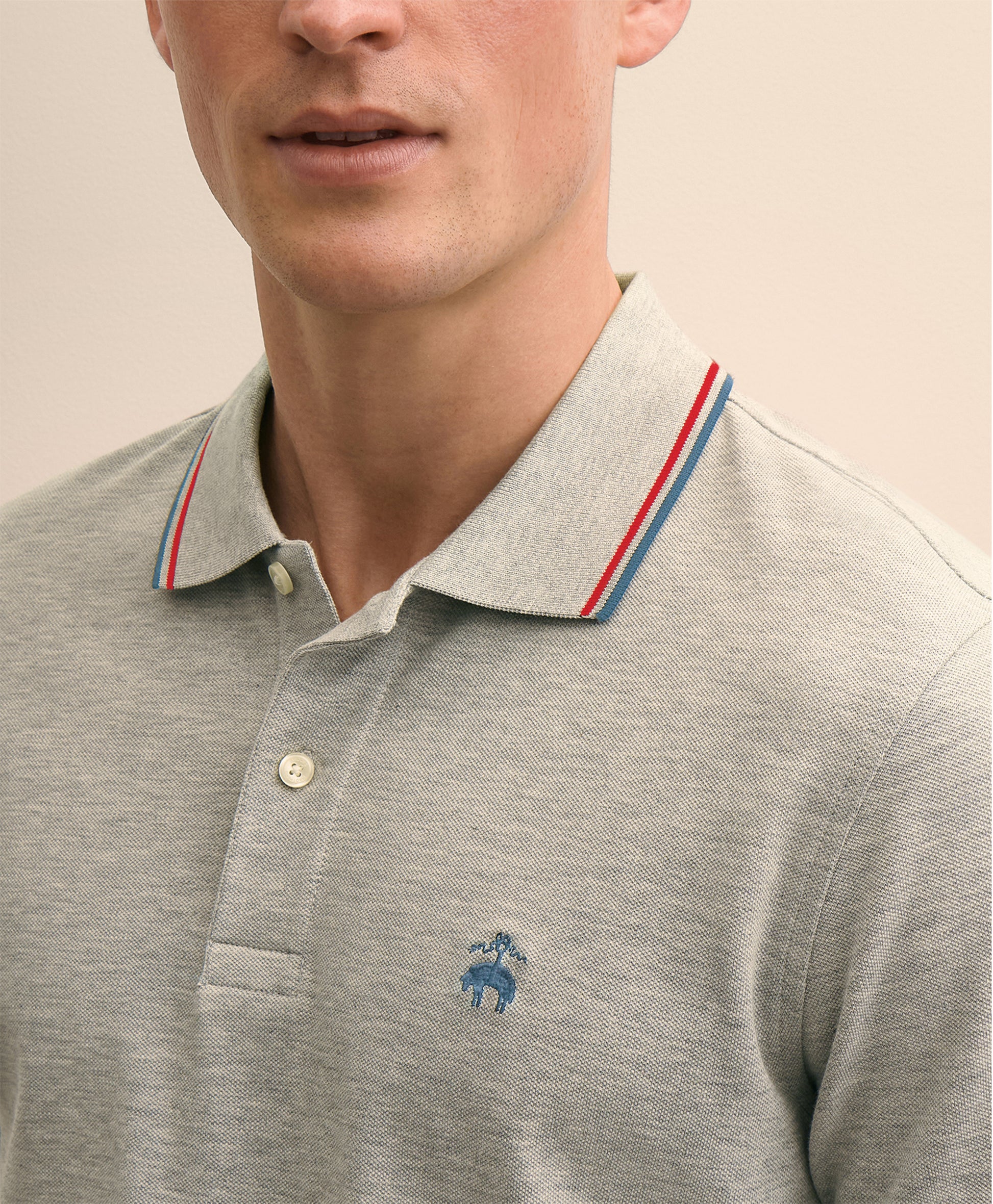 Gray polo shirt with a small logo