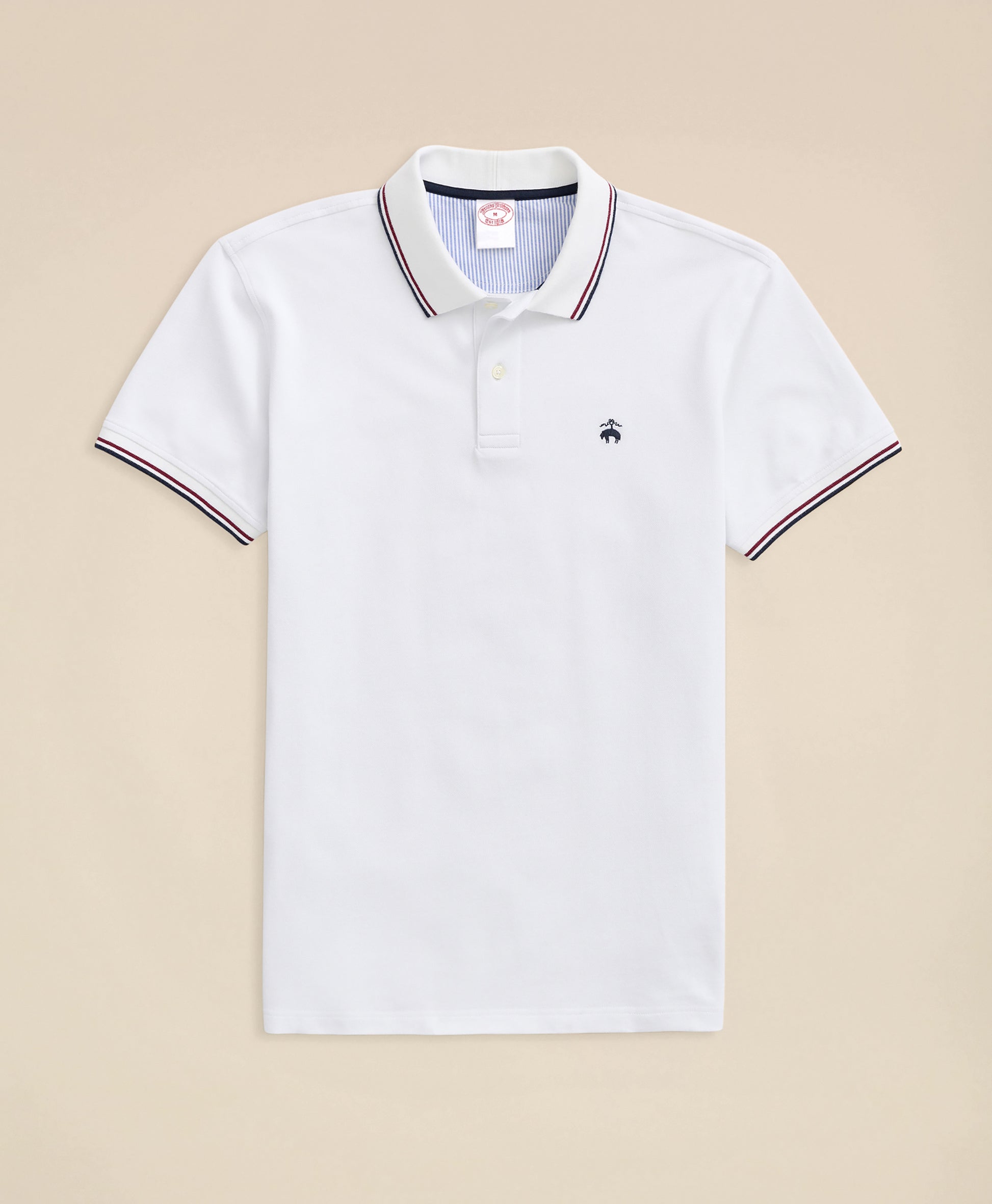 White polo shirt with a small logo