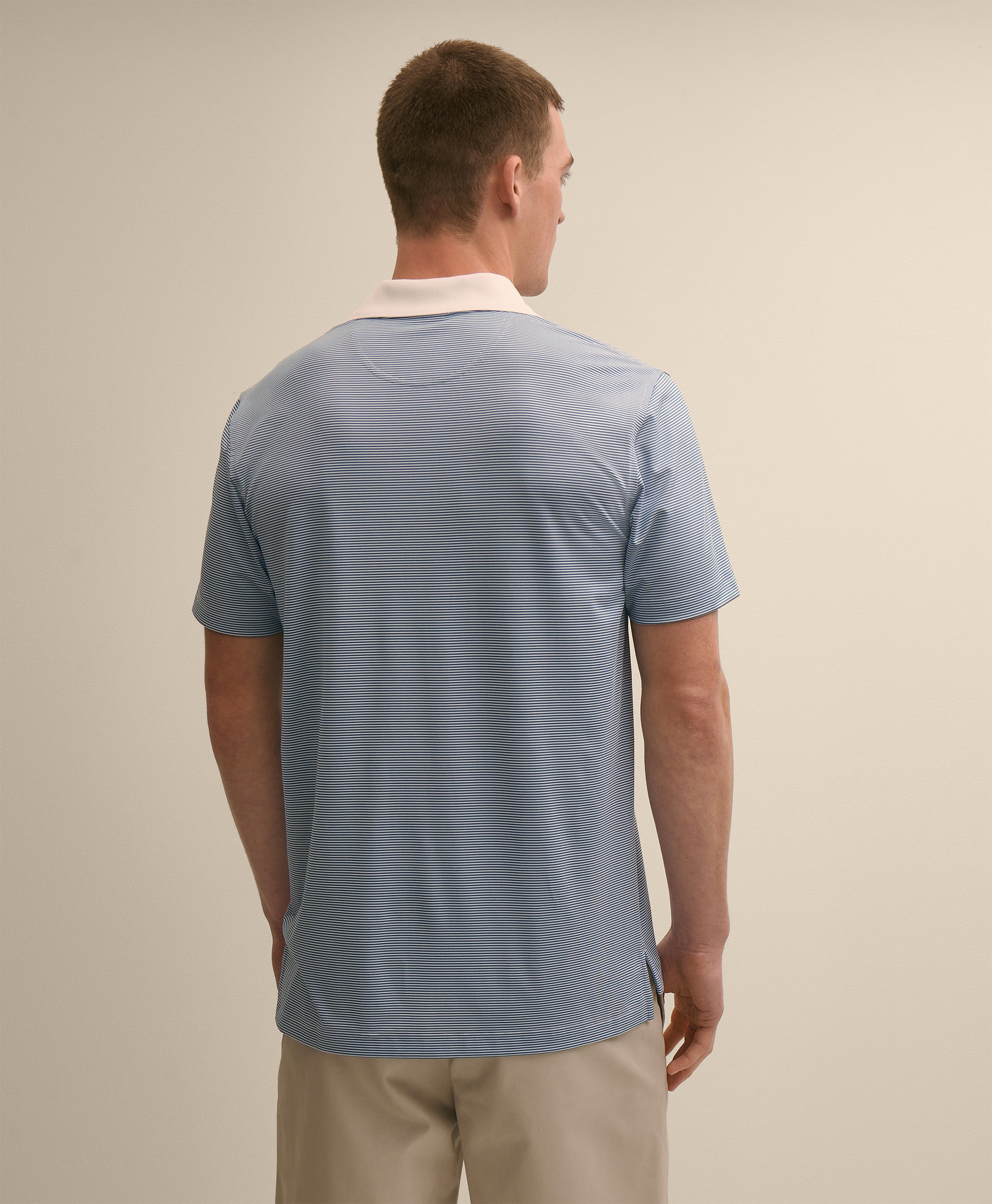 Man wearing a light blue polo shirt