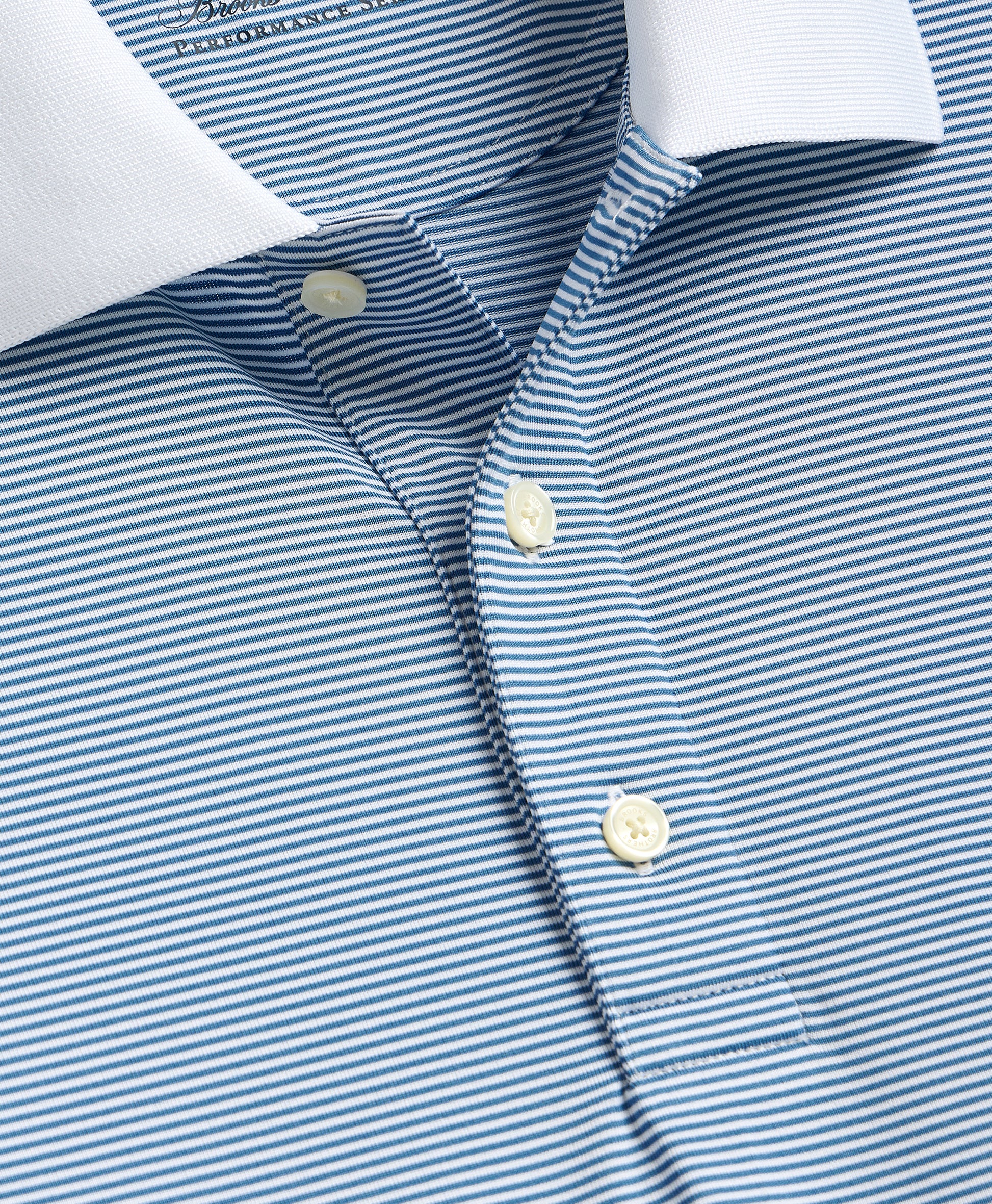 Close-up of a blue and white striped shirt with button details