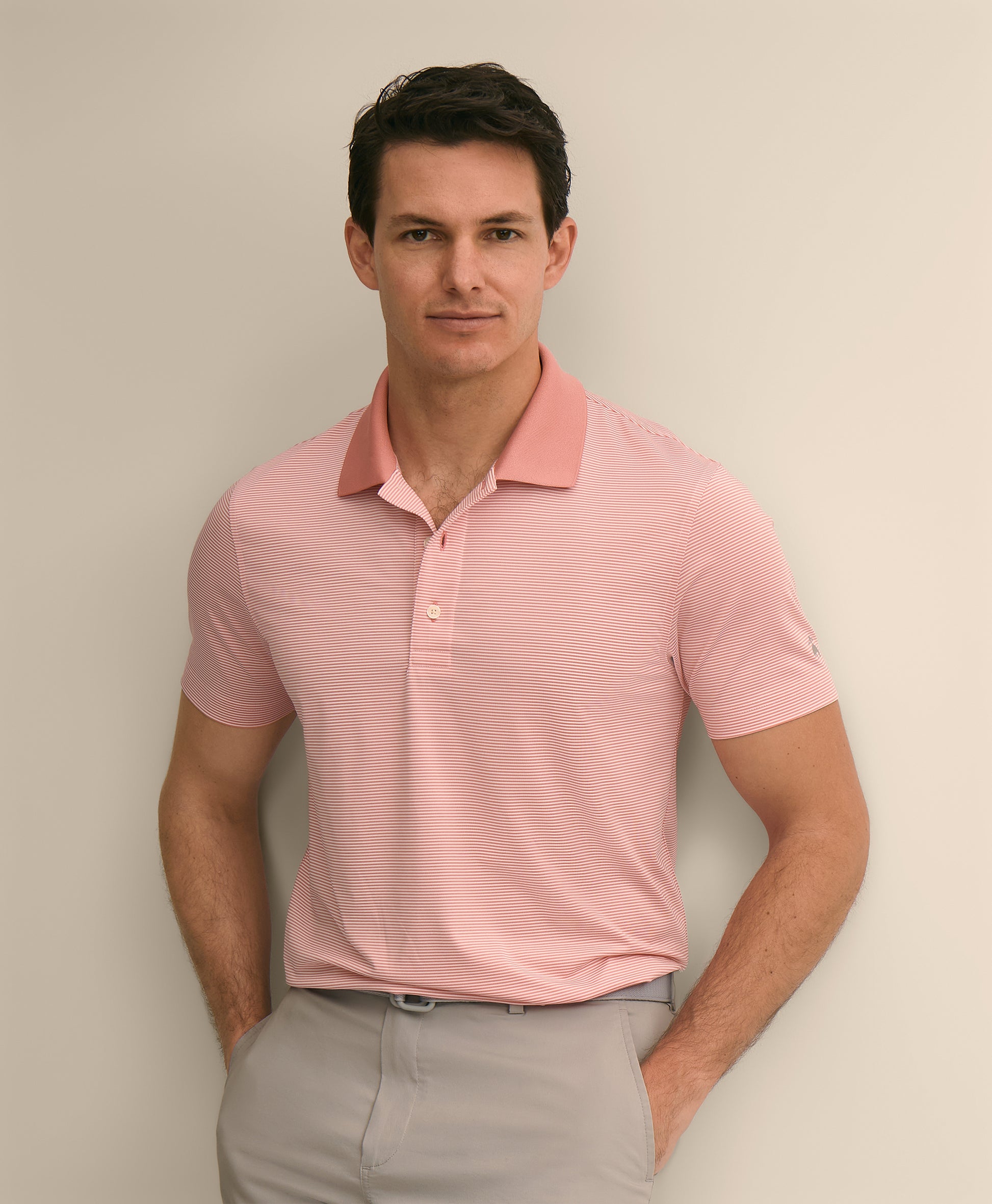 Man wearing a pink polo shirt
