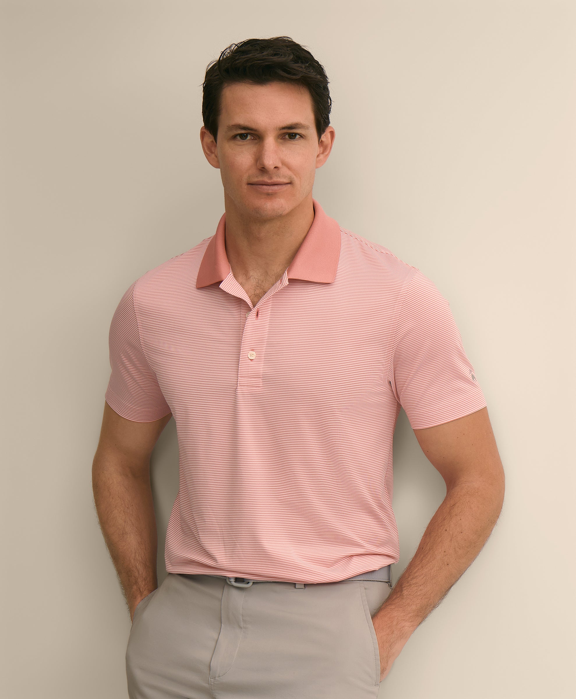 Man wearing a pink polo shirt