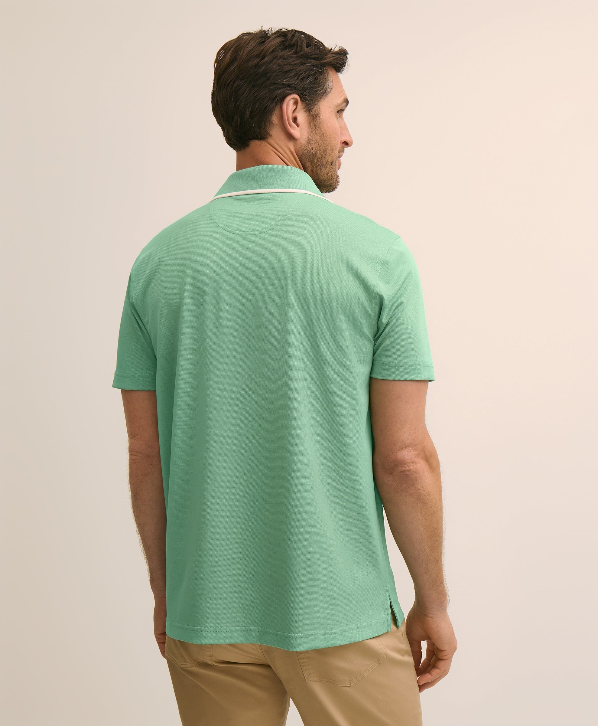 Man wearing a green polo shirt