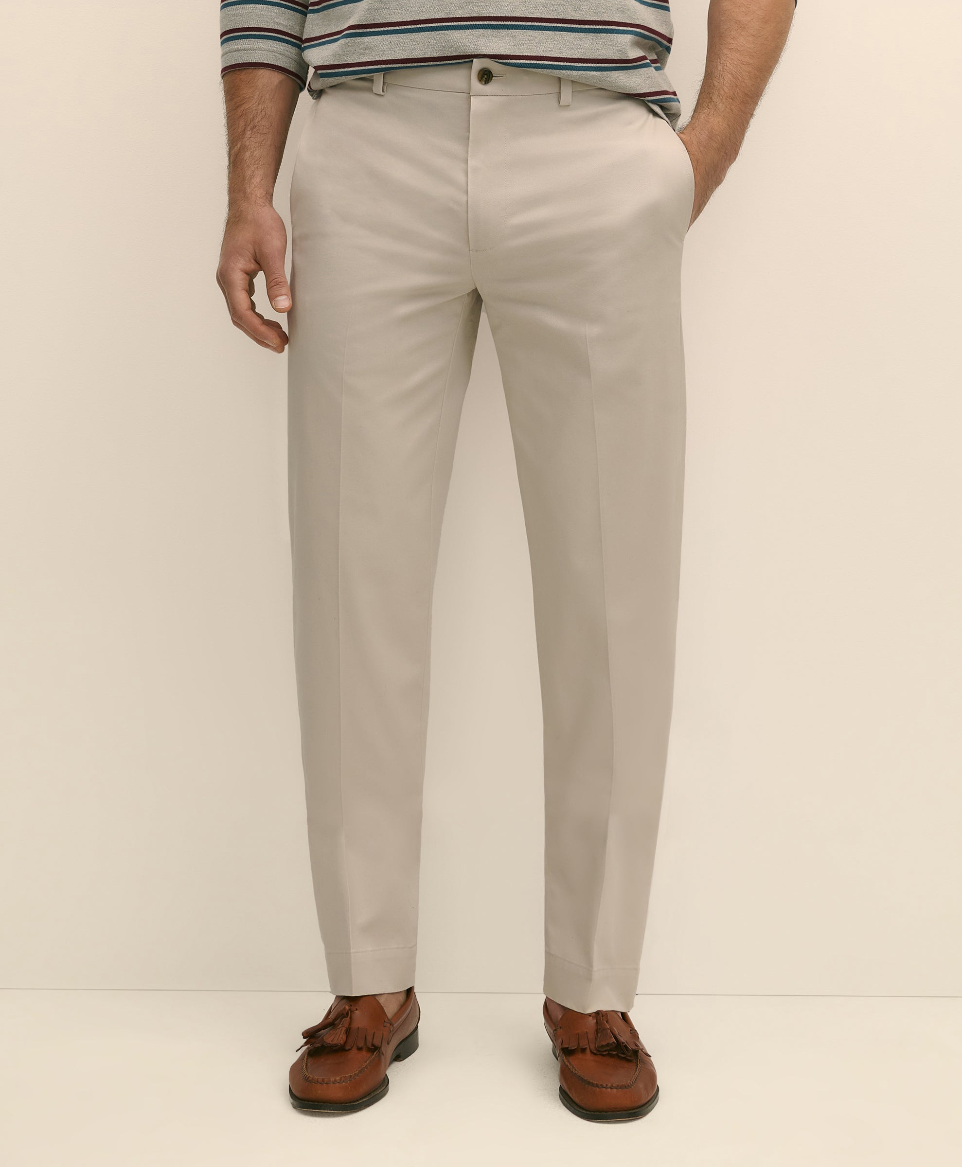 Person wearing beige pants and brown shoes