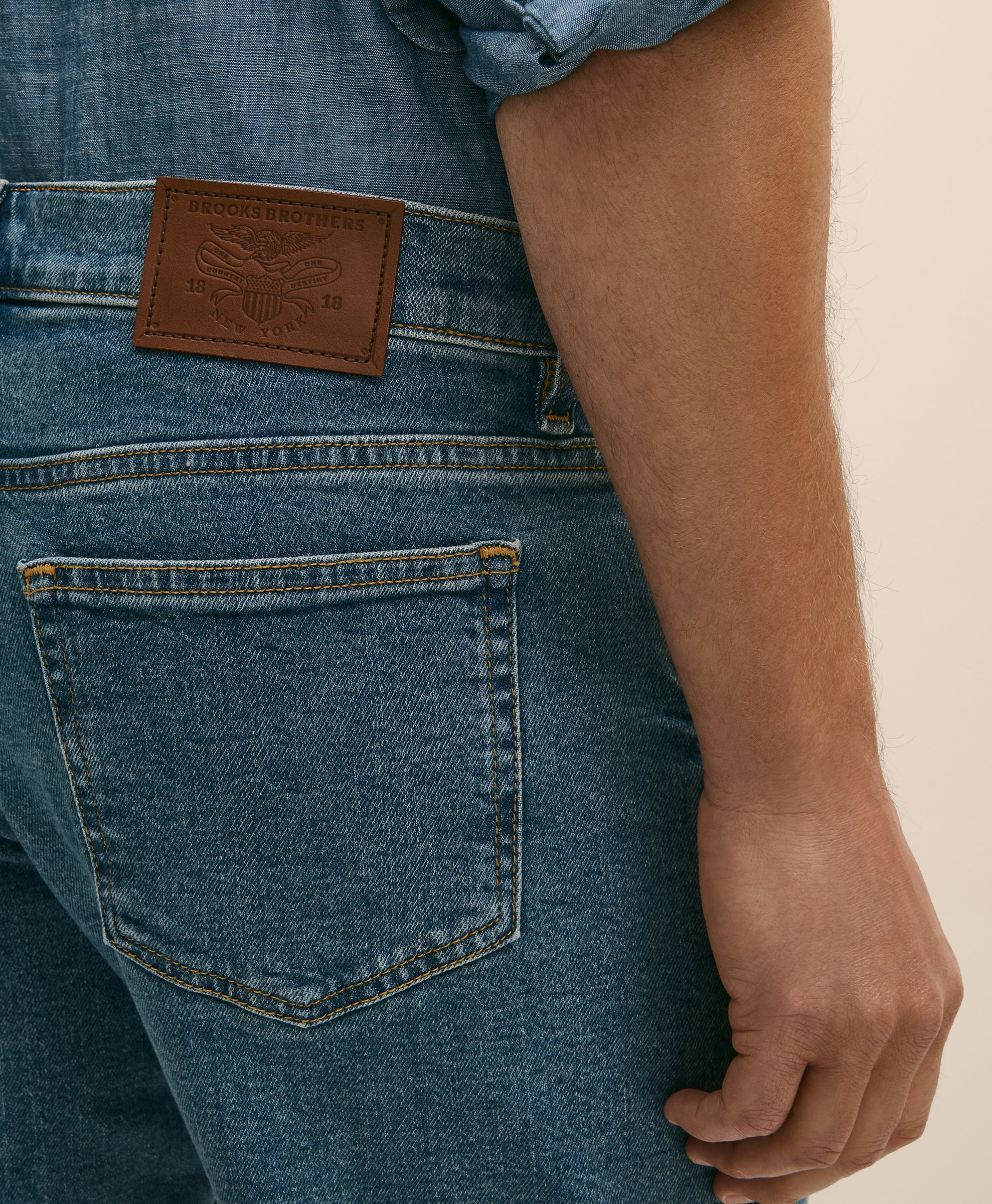 Close-up of blue jeans with a brand label