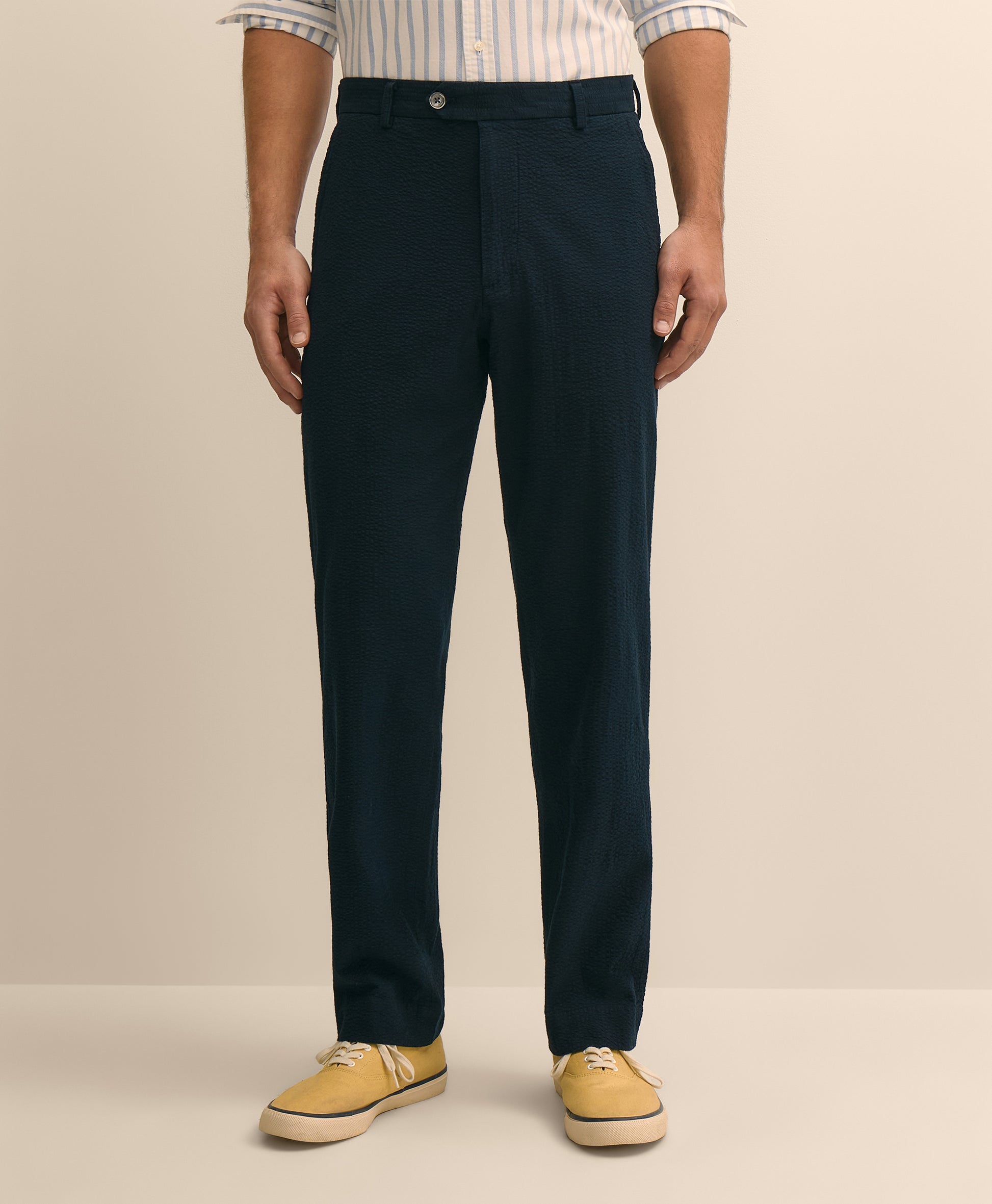 Person wearing navy pants