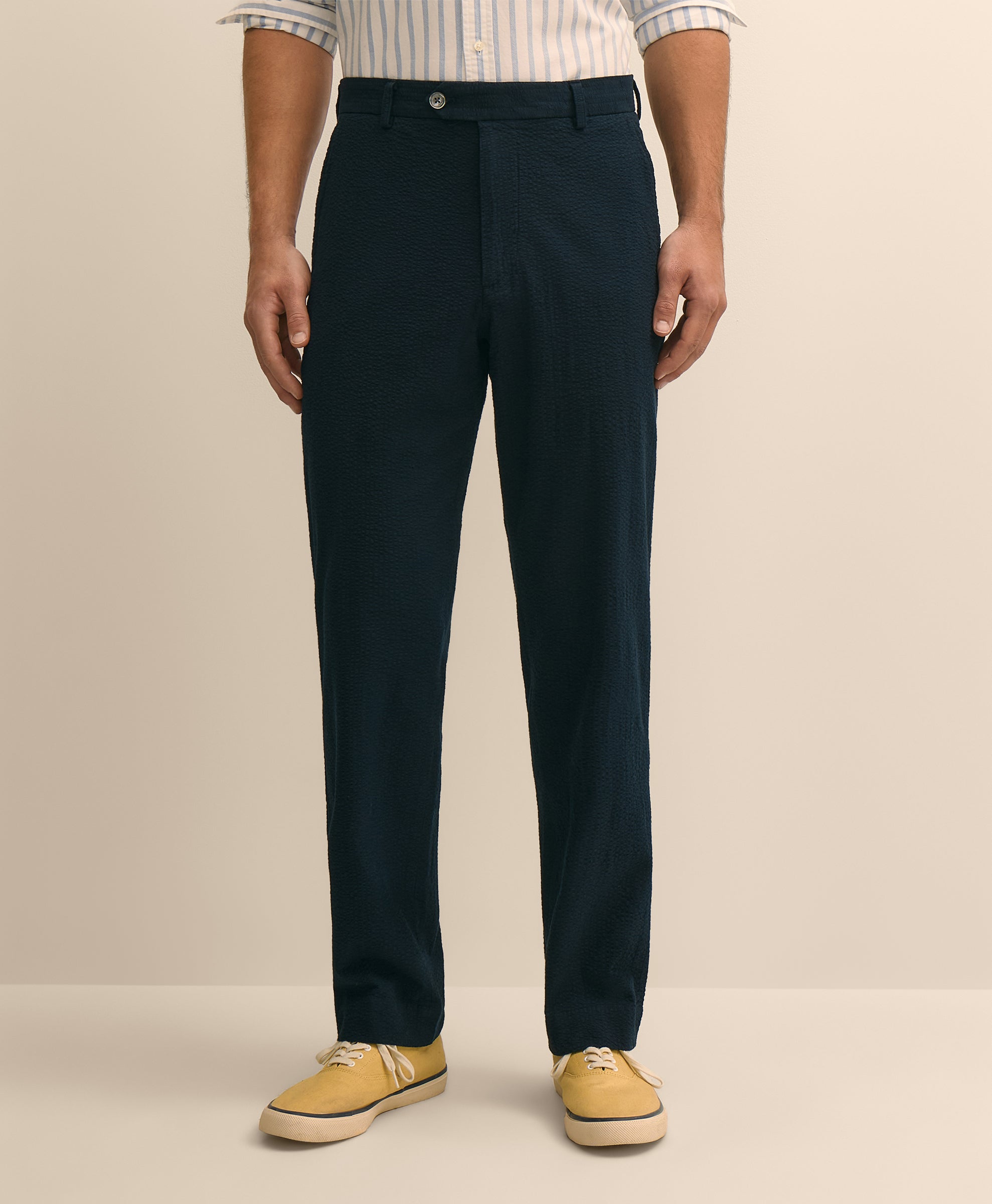 Person wearing navy pants