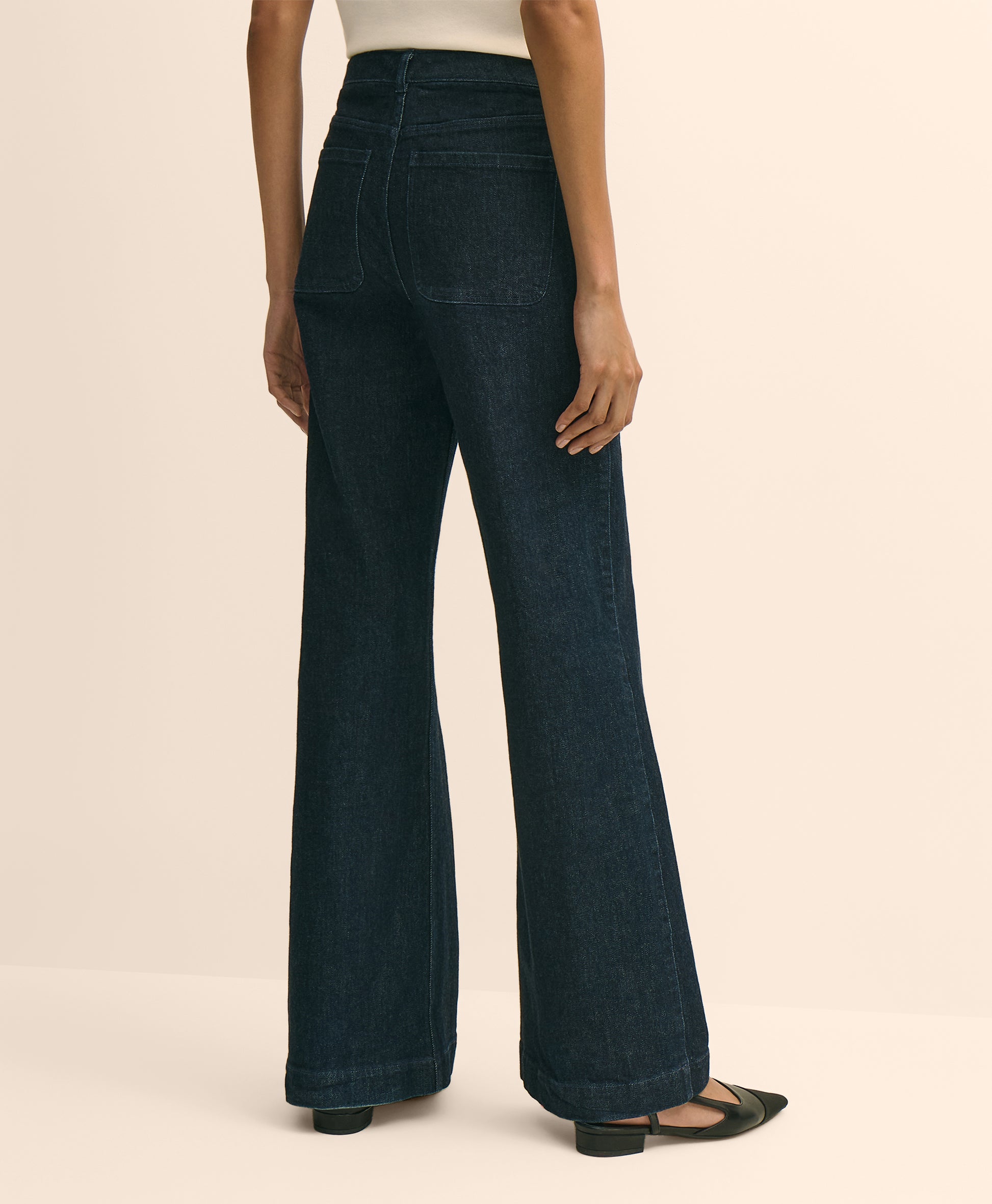 Dark blue jeans worn by a person