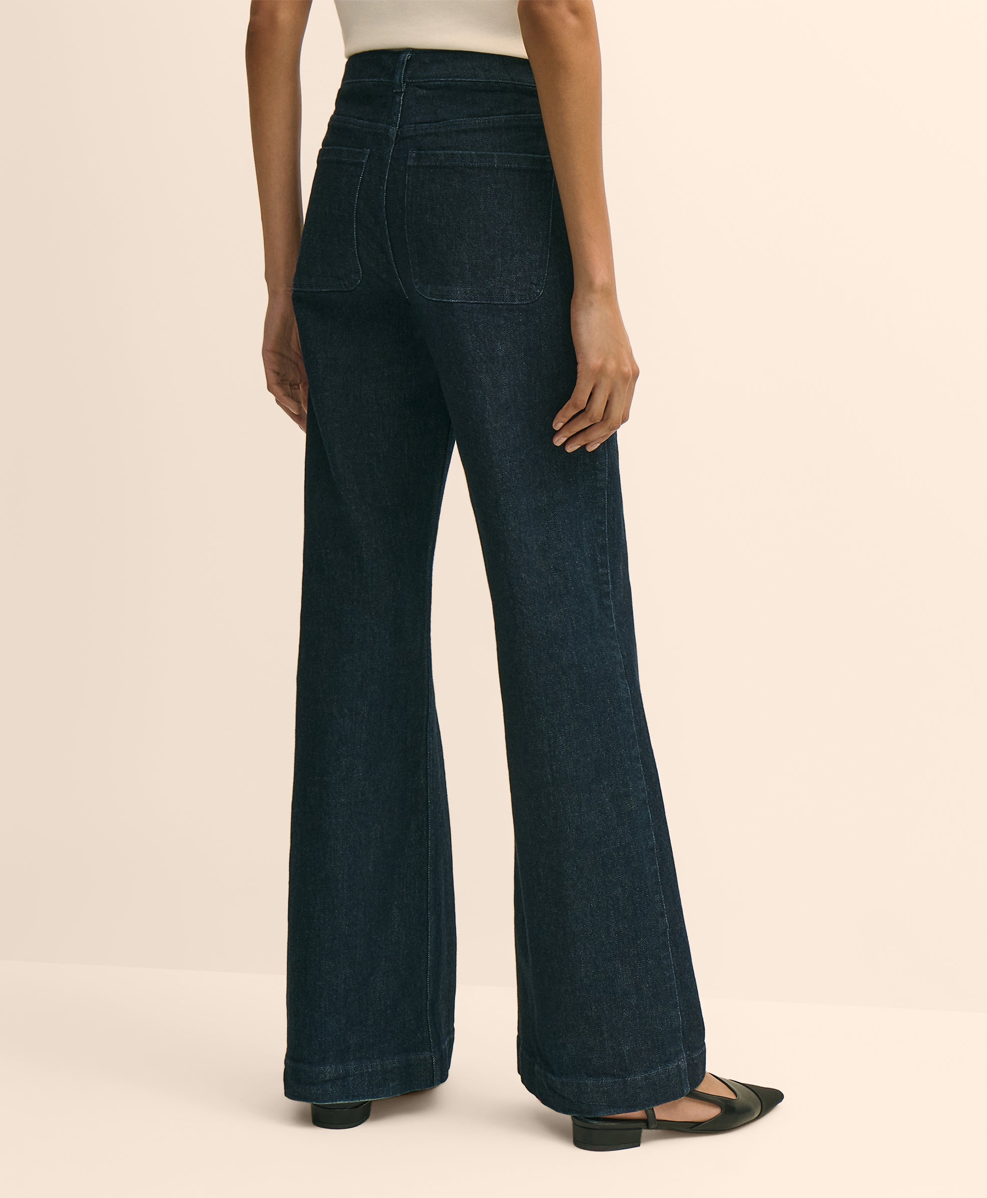 Dark blue jeans worn by a person
